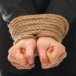 depositphotos_17161631-Close-up-of-businessman-hands-tied-with-rope[1]